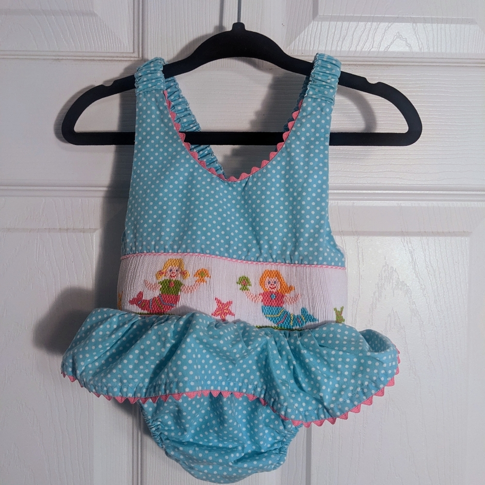 Anavini 6 month smocked swimsuit. Baby blue and white polka dots with Mermaids.